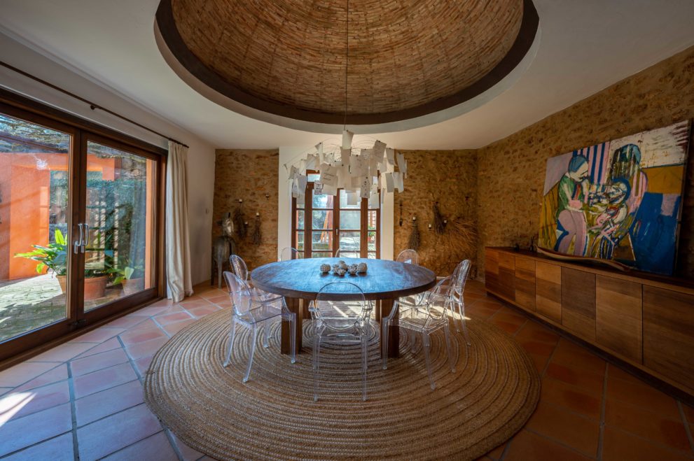 Formal dining area with cupula, stone walls, architectural details